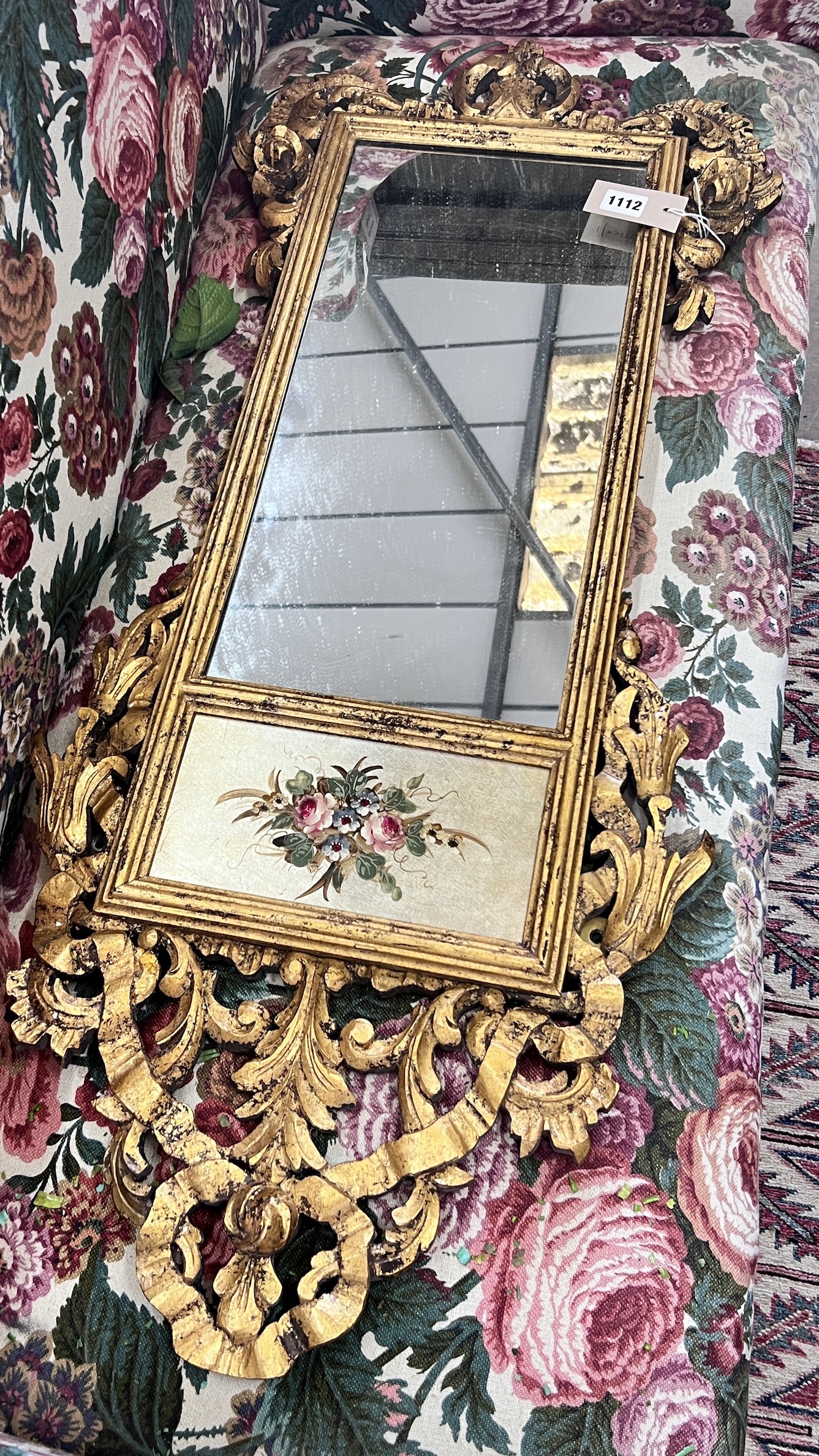 An 18th century style carved giltwood wall mirror, width 44cm, height 112cm